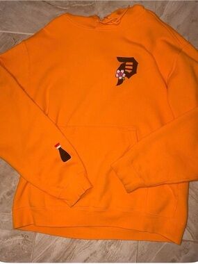 Primitive Orange Hoodie with Small Chest & Sleeve Graphics
